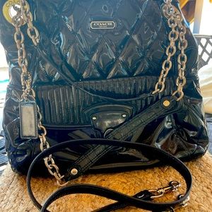 Coach mid-2000’s shiny large crossbody with pink lining. In pre-loved condition